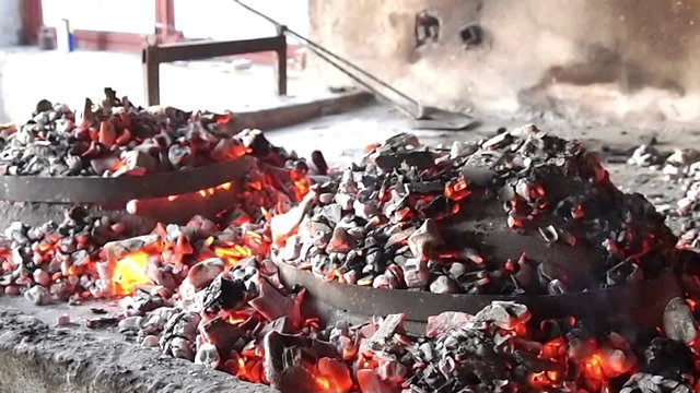 Preparing food on old fireplace