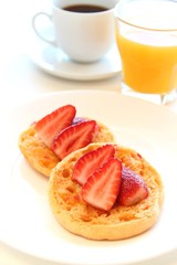 English muffin with strawberries breakfast