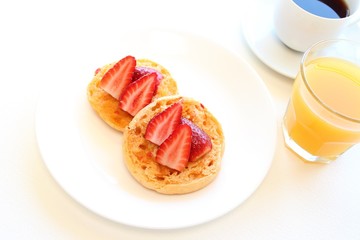 English muffin with strawberries breakfast