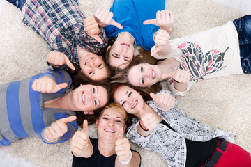 friends happy group heads in circle