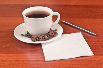 Cup of coffee and napkin
