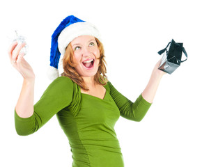 Beautiful happy woman looking inside black shopping gift bag loo