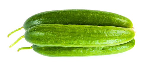 Healthy food. The green cucumbers isolated on white background