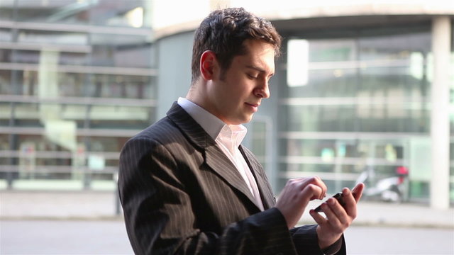 Manager using smartphone for orientation