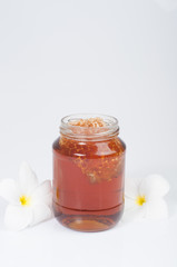 Sweet honey in jar isolated on white