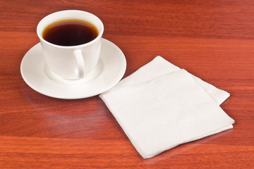 Cup of coffee and napkin