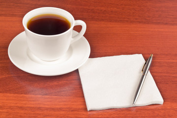 Cup of coffee and napkin