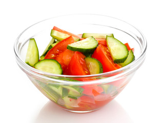 Fresh salad with tomatoes and cucumbers isolated on white