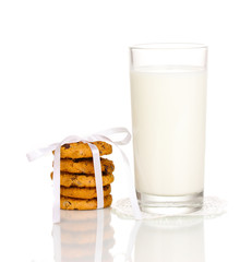 Glass of milk and cookies isolated on white