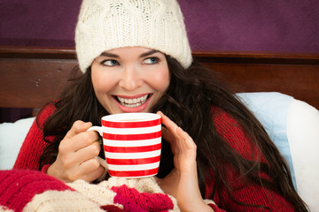 Beautiful woman having hot drink