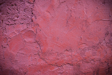 Dark edged pink plaster concrete texture background