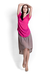 Beautifull woman in pink blouse and beige skirt