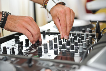 Working Disc jockey at party. Detail of a dj hands.