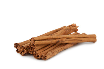 Cinnamon sticks on a white background.