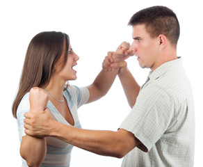 Handsome young man defending himself from angry woman