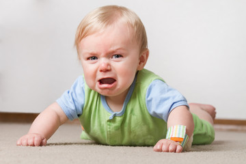 Toddler on the ground crying