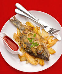 Fried fish with potatoes and onions