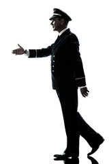 man in airline pilot uniform silhouette walking handshake