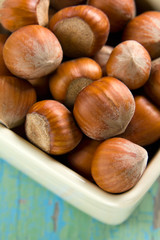 Hazelnuts (filbert) on the vintage wooden surface