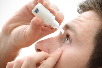Dripping eye with eyes drops