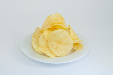 Potato chips, clipping path included on the white plate