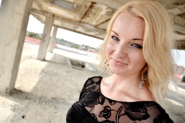 Sexy blond girl in black dress