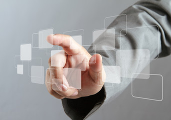hand pushing on a virtual touch screen interface