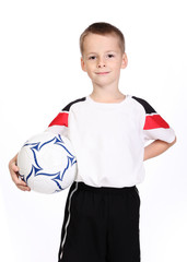 Fototapeta Dziecko sportowiec i piłkarz trzymający piłkę obraz