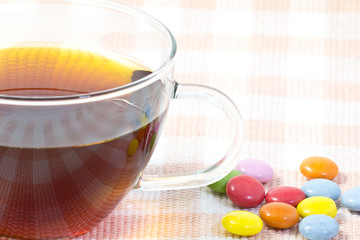 Cup of coffee and colorful chocolate