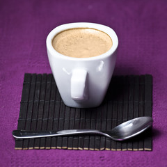 Coffee cup on a purple background