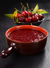 Homemade cherry jam with wild strawberries