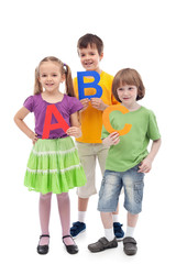 Back to school - kids holding large abc letters