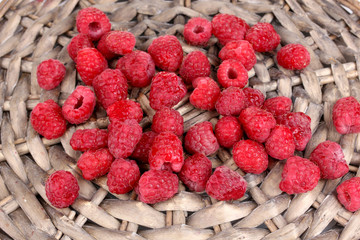 Raspberries on wicker mat close-up
