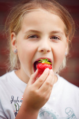 eating a strawberry