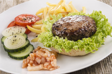 hamburger with salad on a plate