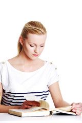 Young student woman with lots of books