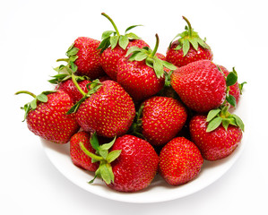 Red strawberry in the bowl closeup