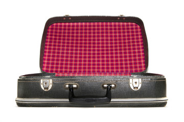 Open vintage suitcase over a white background