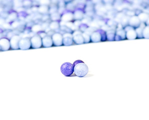 One blue and two violet little pearls