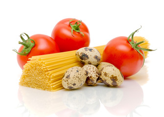 spaghetti, quail eggs and tomatoes on a white background