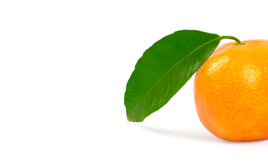 Tangerine with green leaves isolated on white