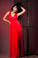 elegant fashionable woman in red dress