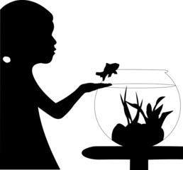 Cute small girl returning fish back into the aquarium silhouette