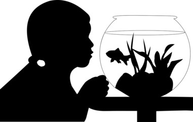 Cute small girl looking  at her fish in the aquarium silhouette