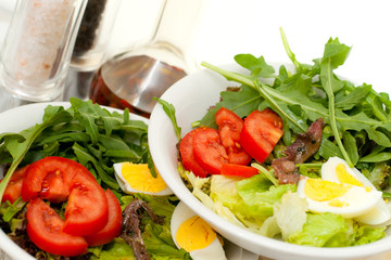 Mix Salad with eggs and anchovies with salt and pepper.