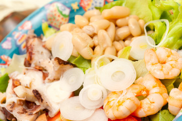 Mix Salad with octopus, shrimps, beans and union.