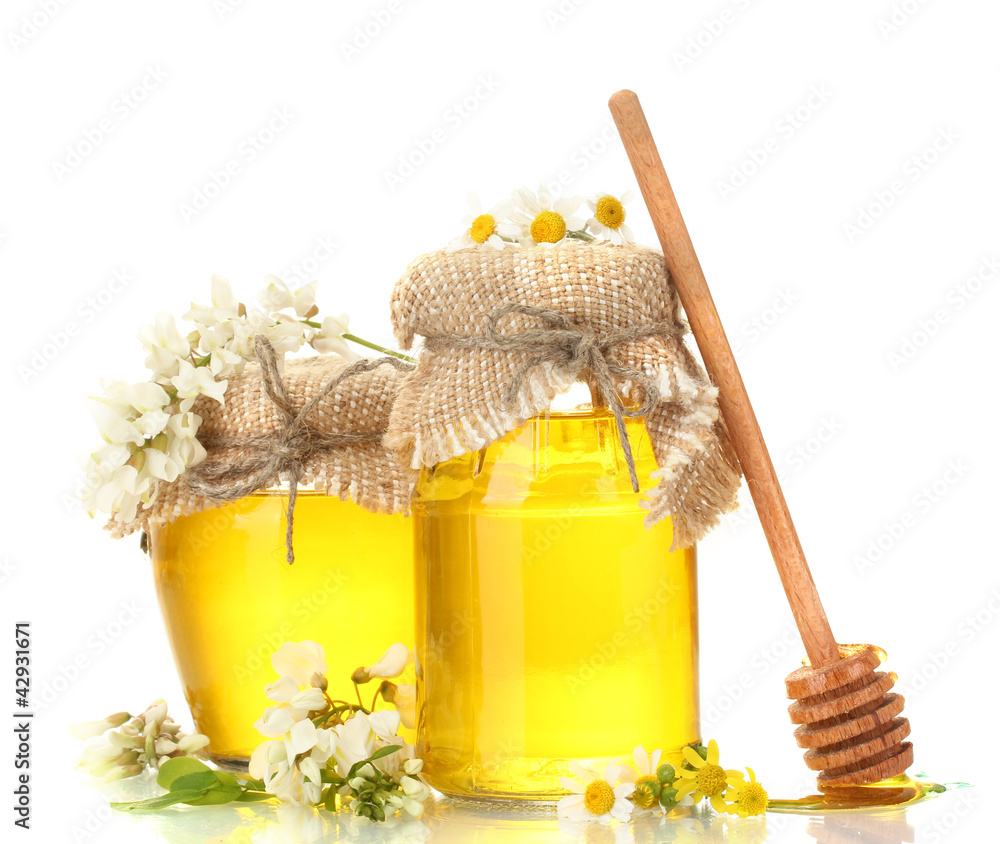 Wall mural sweet honey in jars and acacia flowers isolated on white