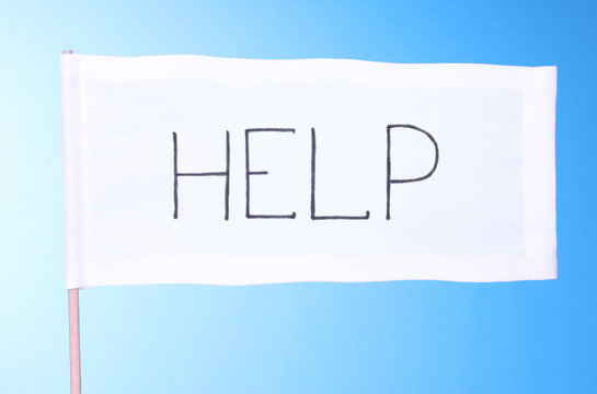 Fototapeta Help written on white cloth on blue background