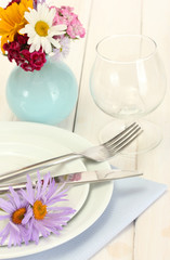 beautiful holiday table setting with flowers