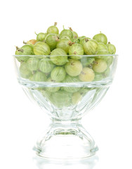 Green gooseberry in glass isolated on white